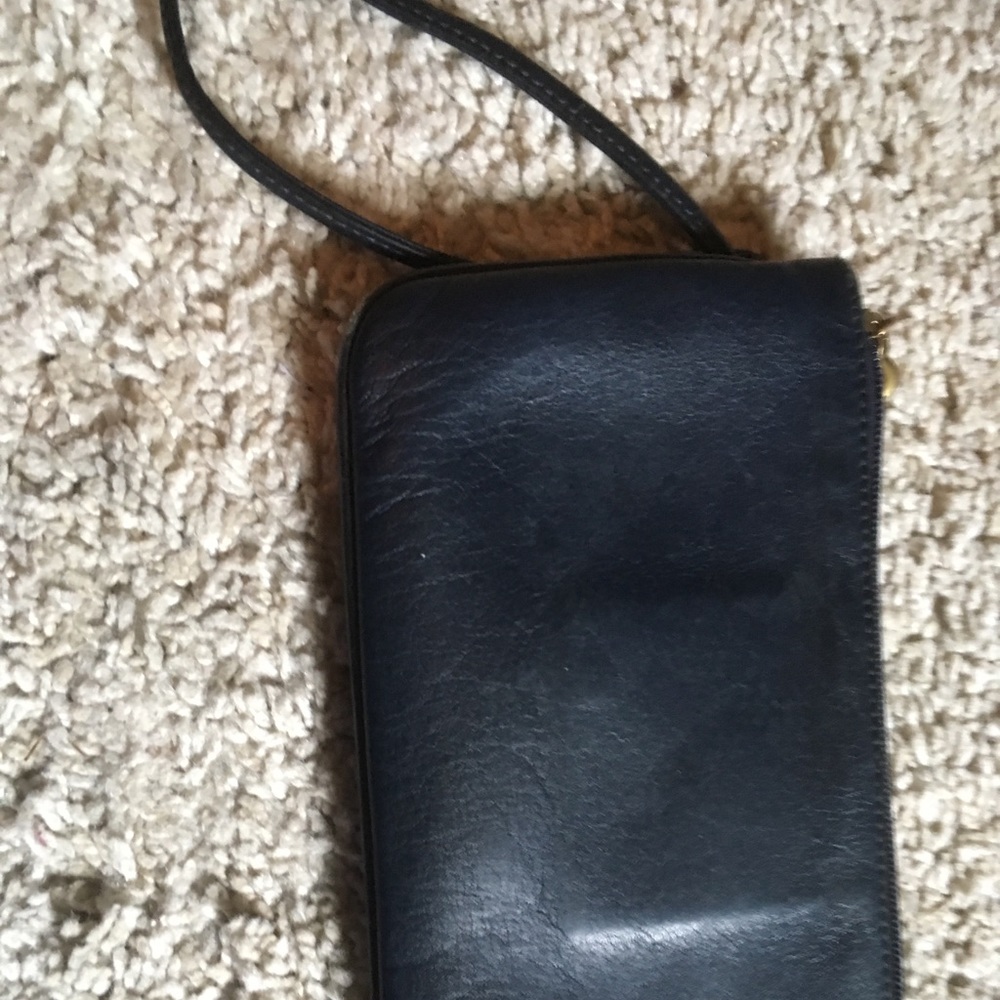 Coach navy leather wristlet, brass buckle pocket